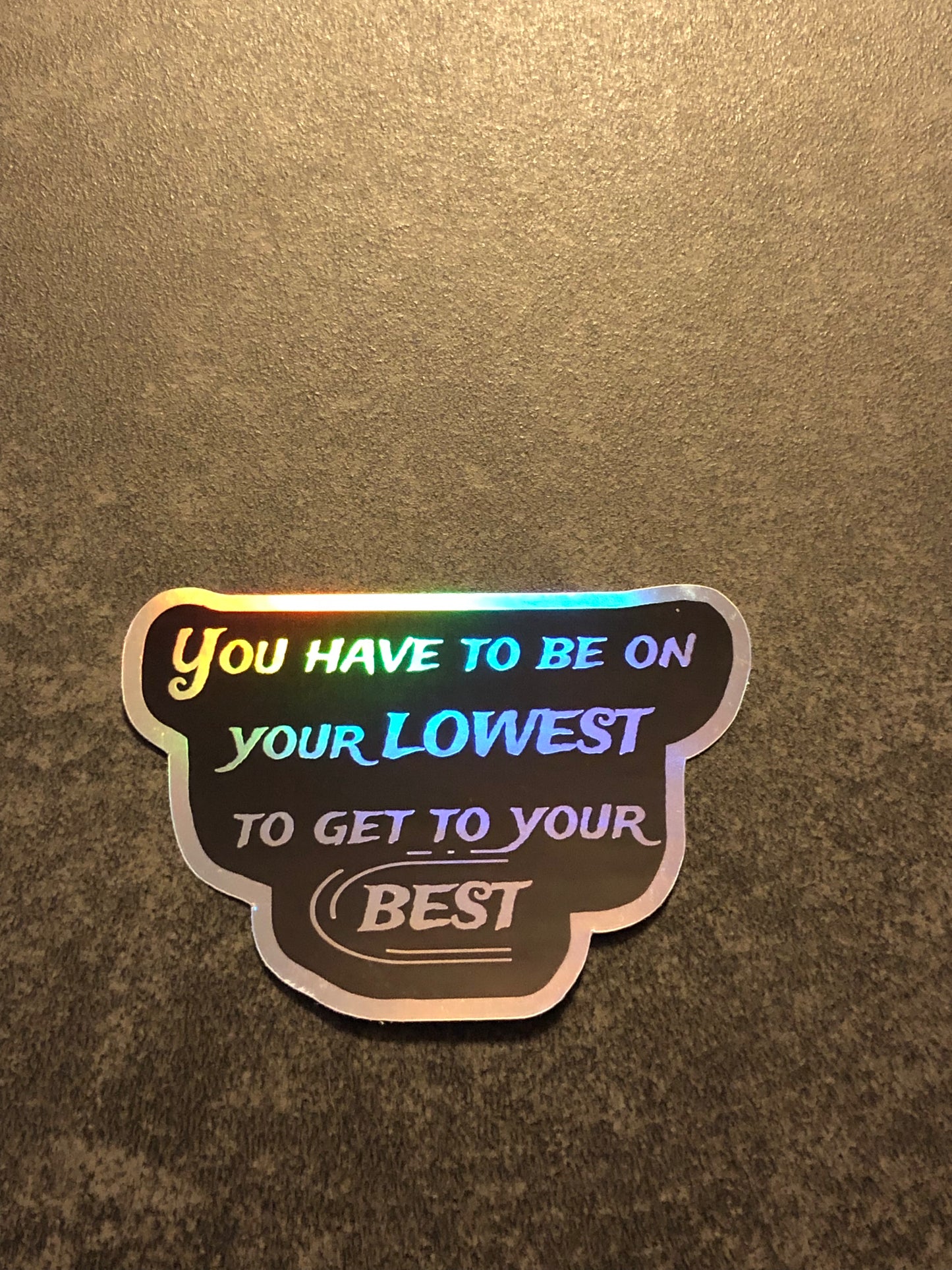 Holografischer Aufkleber „Niemals aufgeben“.